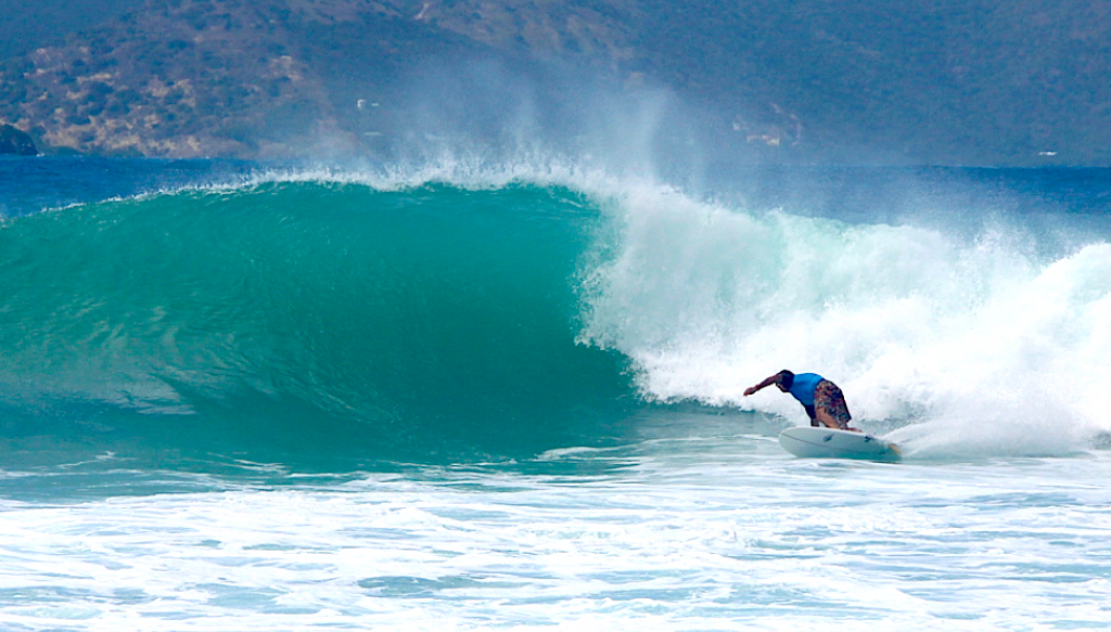 Dave Carson surfing