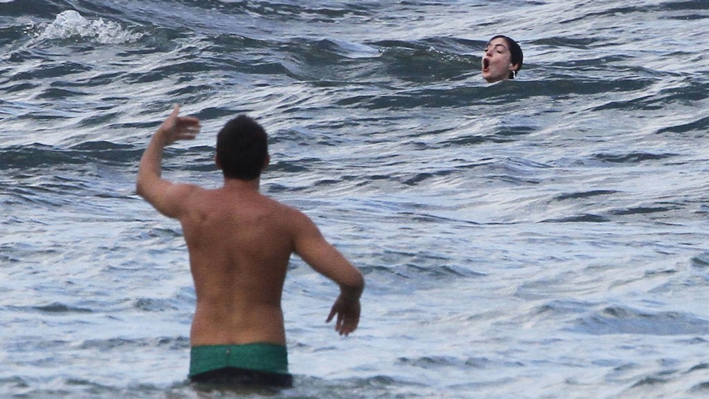 Anne Hathaway experiences the treacherous waters of the Pacific while vacationing in Hawaii! She survived!