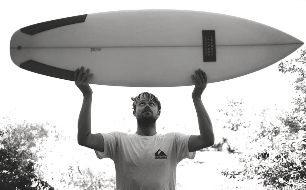 Dane Reynolds with a mountain and wave over his heart. The salad years!