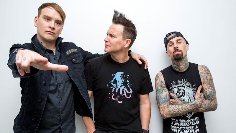 Hoppus, middle, giving the man on his right a funny look because he isn't Tom DeLonge.