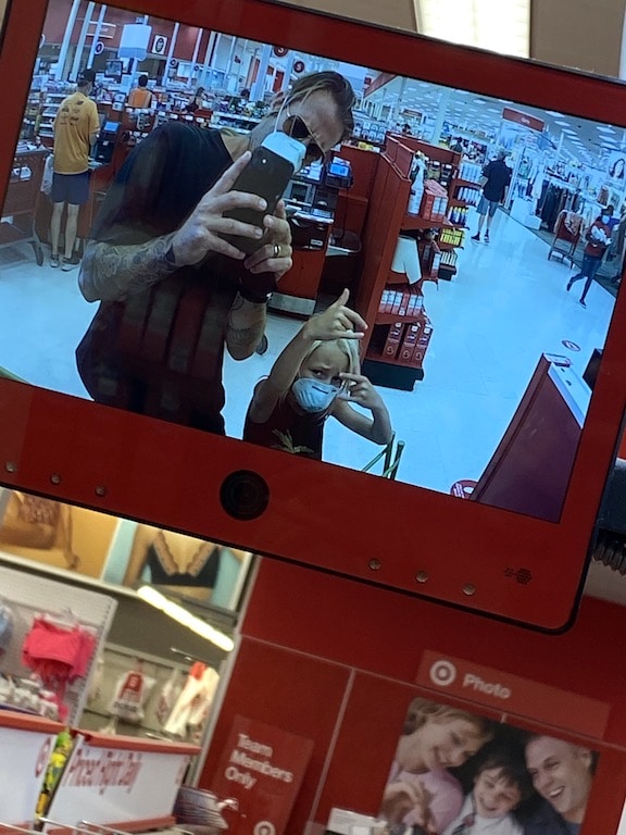 Surfer-father and young daughter (pictured) getting robbed by Target.