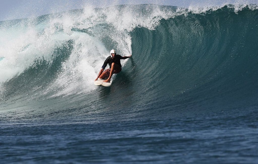 Simms, pictured, surfing. Photo: Jason Childs.