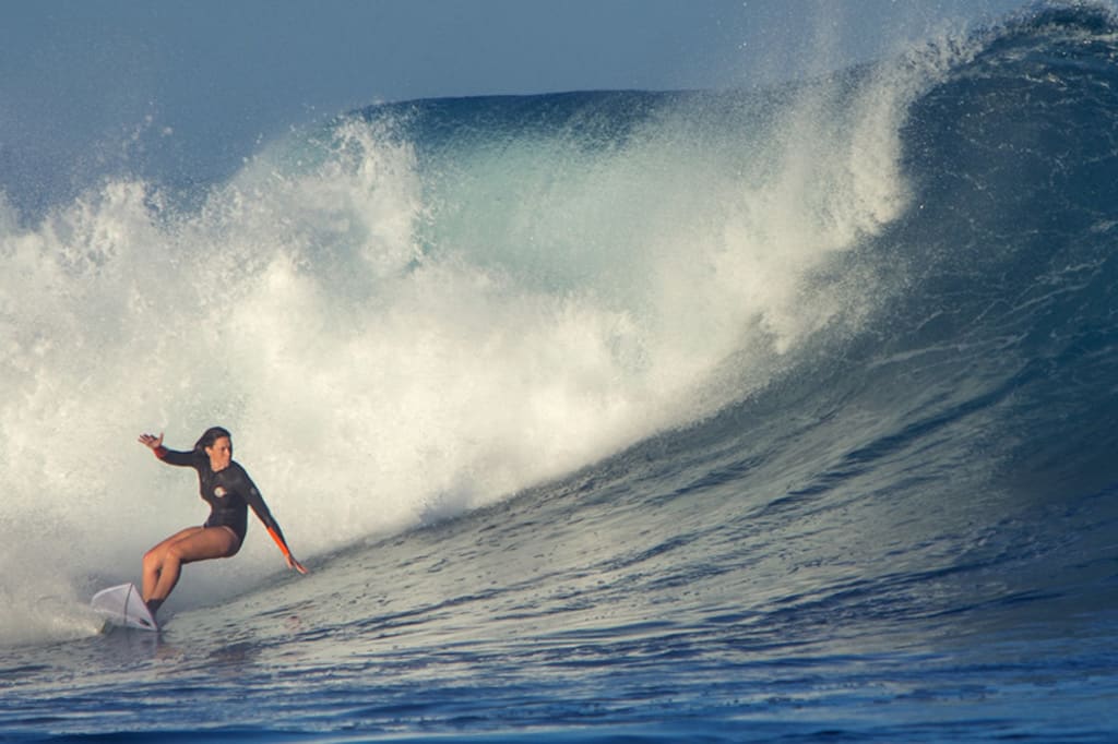 Farris (pictured) ripping the curl. Photo: The Mermaid Society
