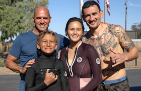 Max Holloway with wife Alessa, son Rush and surfer Kelly Slater.