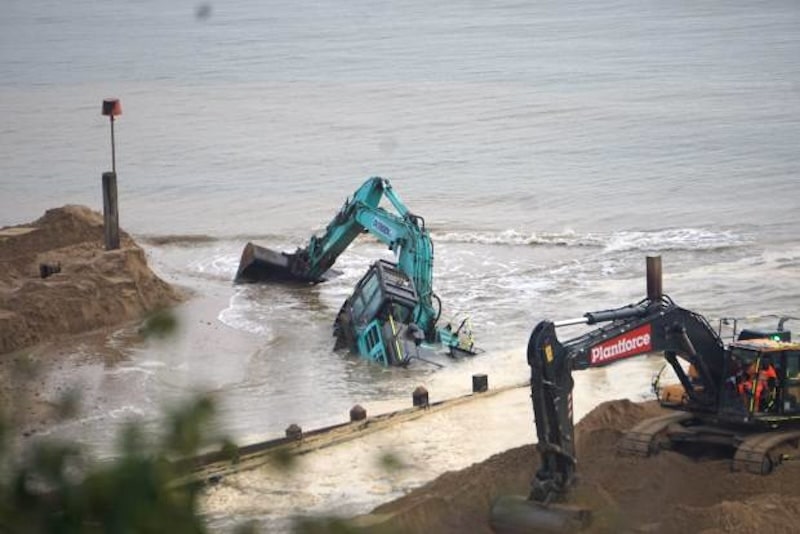 Excavators (pictured) really messing up a non-Malibu beach. Photo: WhatsApp