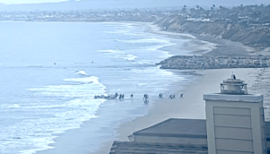 Immigrants land panga boat on Carlsbad Beach.