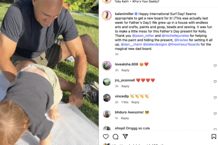 Kelly Slater with baby Tao.