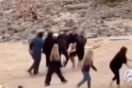 Teenager carried up the beach after shark attack at Cabarita, NSW.