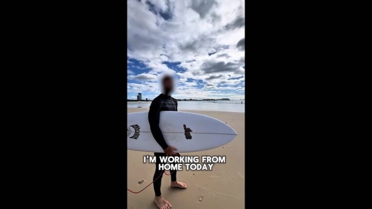 Aussie surfer rides waves on company time in viral “Do Nothing” vid