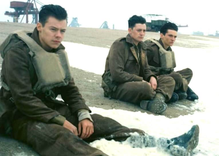 Harry Styles (left) and the surfing mystery of mysteries.